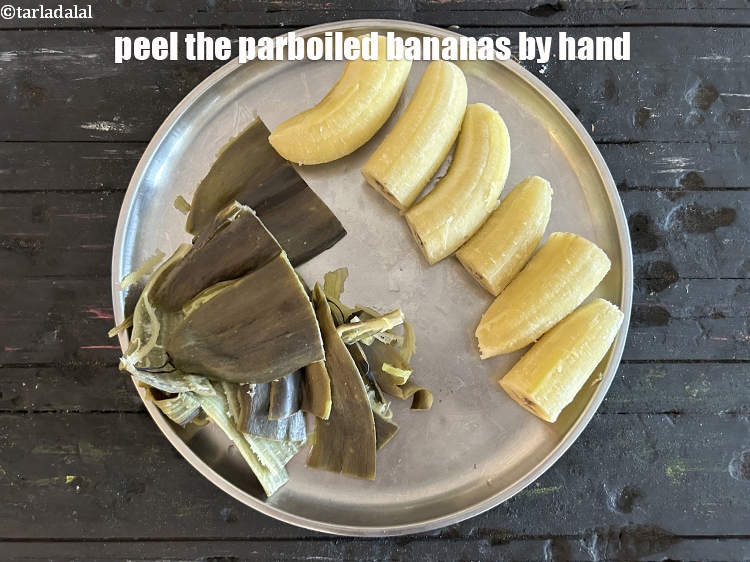 Step 8 – Peel the parboiled raw bananas by hand. &nbsp;