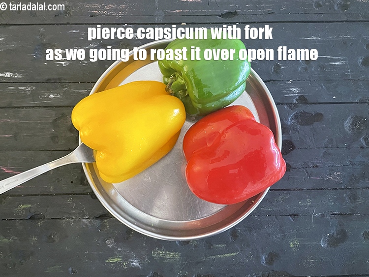 Step 8 – <meta charset="UTF-8" />Pierce each red capsicum with a fork. We are going to be roasting …