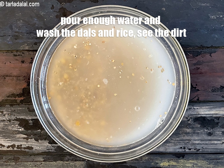 Step 8 – Pour enough water to wash the dals and rice. You can see the dirt.