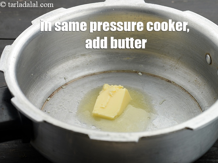 Step 11 – In the same pressure cooker, add 2 tsp butter.