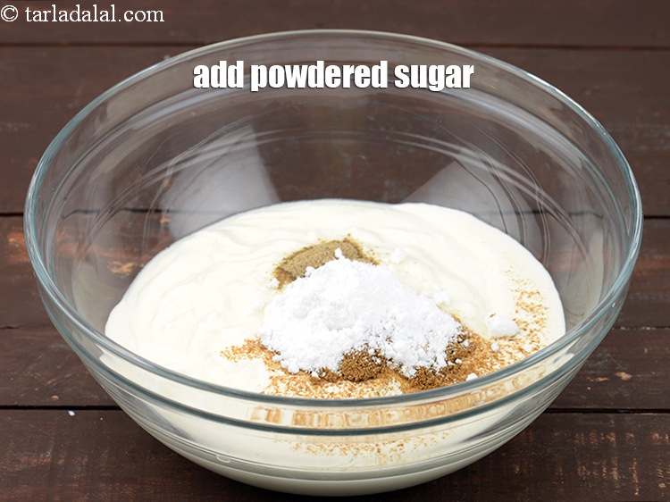 Step 12 – Add 2 tsp <a href="https://www.tarladalal.com/glossary-powdered-sugar-280i">powdered sugar</a>. To balance the sourness of the curd.