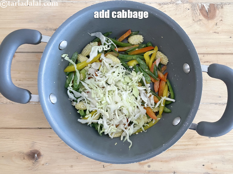 Step 12 – Add&nbsp;<meta charset="UTF-8" />1/2 cup&nbsp;<a href="glossary-shredded-cabbage-763i">shredded cabbage</a>.