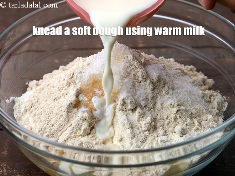 Step 9 – Knead a soft dough using approx. 1 cup warm&nbsp;<a href="https://www.tarladalal.com/glossary-milk-doodh-full-cream-milk-514i">milk</a>.