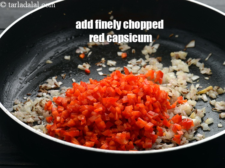 Step 8 – Add 1/2 cup finely&nbsp;<a href="https://www.tarladalal.com/glossary-chopped-red-capsicum-2299i">chopped red capsicum</a>.