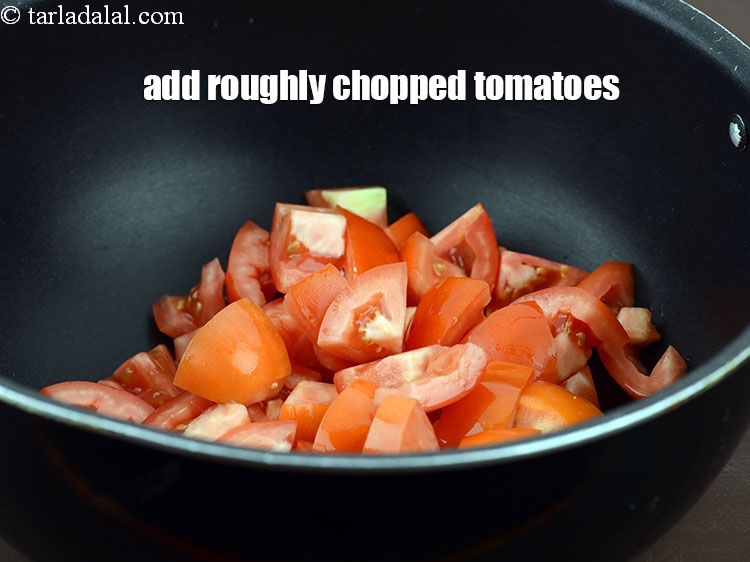 Step 8 – Add 2 cup roughly <a href="https://www.tarladalal.com/glossary-chopped-tomatoes-779i">chopped tomatoes</a>.