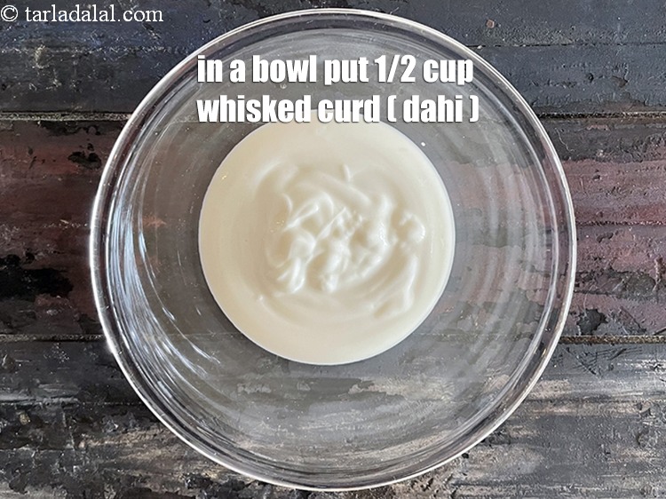 Step 15 – In a bowl put&nbsp;<meta charset="UTF-8" />1/2 cup&nbsp;<a href="glossary-curd-dahi-yogurt-yoghurt-383i">curd (dahi)</a>&nbsp;, whisked.