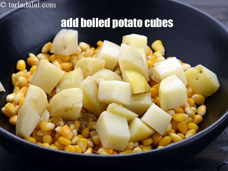 Step 8 – Add 1 cup&nbsp;<a href="https://www.tarladalal.com/glossary-boiled-potato-cubes-2312i">boiled potato cubes</a>.&nbsp;
