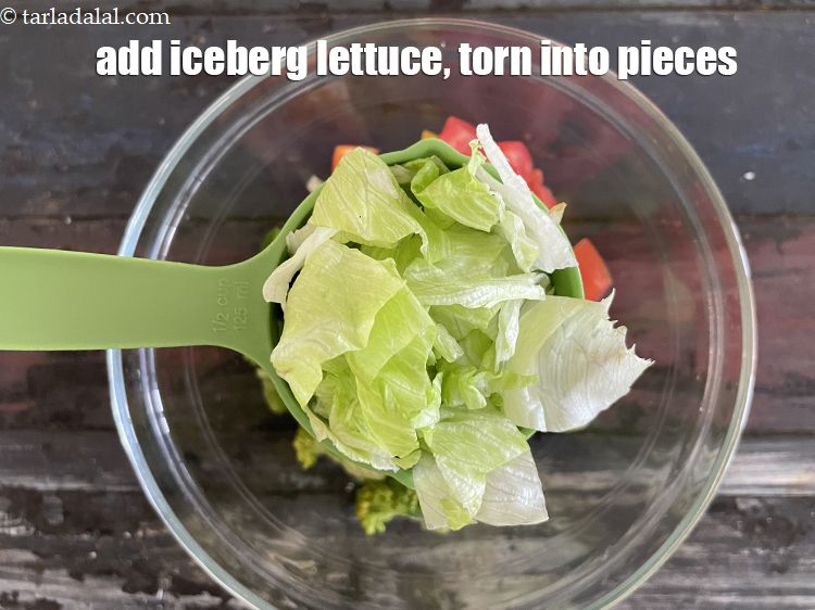 Step 22 – Add&nbsp;1/2 cup&nbsp;<a href="glossary-iceberg-lettuce-iceberg-salad-ke-patte-499i">iceberg lettuce</a>&nbsp;, torn into pieces.