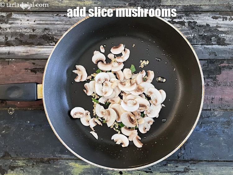 Step 14 – Add&nbsp;1/2 cup&nbsp;sliced&nbsp;<a href="glossary-mushrooms-khumb-dhingri-493i">mushrooms (khumbh)</a>.