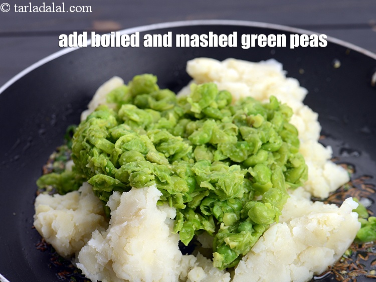 Step 9 – Add 3/4 cup&nbsp;<a href="https://www.tarladalal.com/glossary-boiled-and-mashed-green-peas-1901i">boiled and mashed green peas</a>.