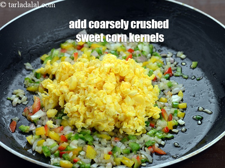 Step 8 – Add 1/2 cup coarsely&nbsp;<a href="https://www.tarladalal.com/glossary-crushed-sweet-corn-kernels-1605i">crushed sweet corn kernels (makai ke dane)</a>.