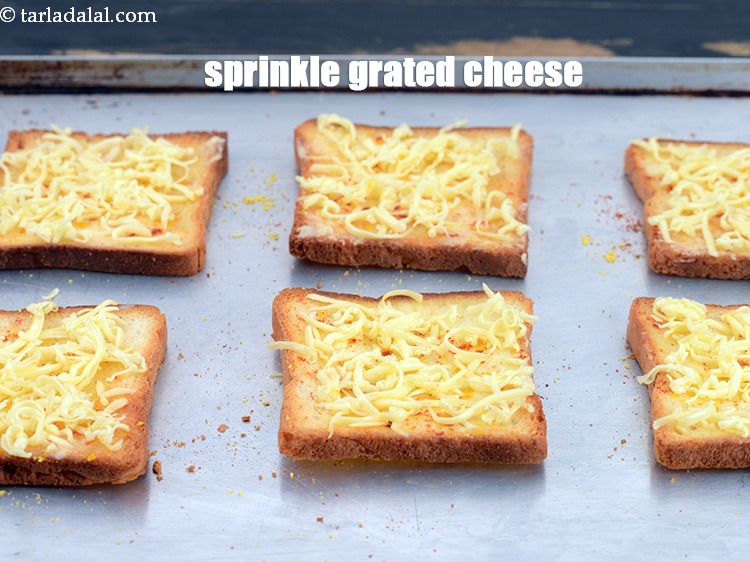 Step 8 – Finally sprinkle 1 tbsp <a href="https://www.tarladalal.com/glossary-grated-processed-cheese-868i">grated cooking cheese</a> evenly over each slice.&nbsp;