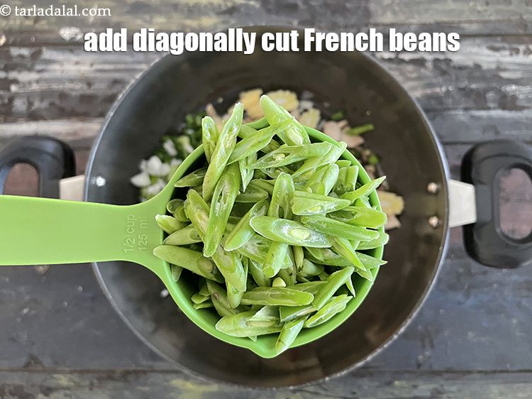 Step 11 – Add&nbsp;1/2 cup&nbsp;<a href="glossary-diagonally-cut-french-beans-2461i">diagonally cut french beans</a>.