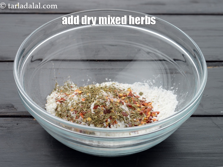Step 8 – Add 1/2 tsp&nbsp;<a href="https://www.tarladalal.com/glossary-dried-mixed-herbs-466i">dried mixed herbs</a>.&nbsp;