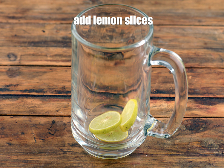Step 8 – Add 3 <a href="https://www.tarladalal.com/glossary-lemon-slices-758i">lemon slices</a>.