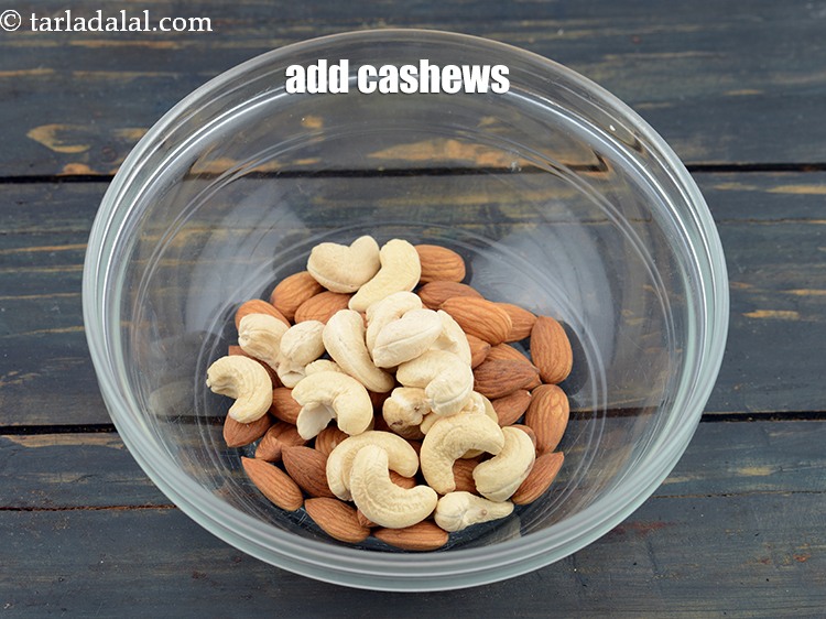Step 8 – Add 1/2 cup&nbsp;<a href="https://www.tarladalal.com/glossary-cashew-nuts-kaju-840i">cashew nuts (kaju)</a>.&nbsp;