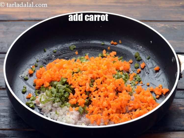 Step 8 – Add 1/2 cup&nbsp;finely chopped and&nbsp;<a href="https://www.tarladalal.com/glossary-chopped-and-boiled-carrots-1080i">boiled carrots</a>.&nbsp;