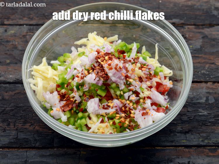 Step 8 – Add 2 tsp&nbsp;<a href="https://www.tarladalal.com/glossary-dry-red-chilli-flakes-paprika-338i">dry red chilli flakes (paprika)</a>.&nbsp;
