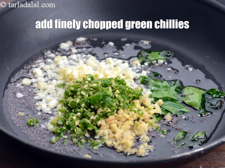 Step 10 – Add 1 tbsp finely <a href="https://www.tarladalal.com/glossary-chopped-green-chilli-820i">chopped green chillies</a>.