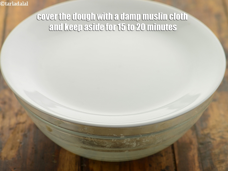 Step 8 – Cover the dough with a damp muslin cloth and keep aside for 15 to 20 …