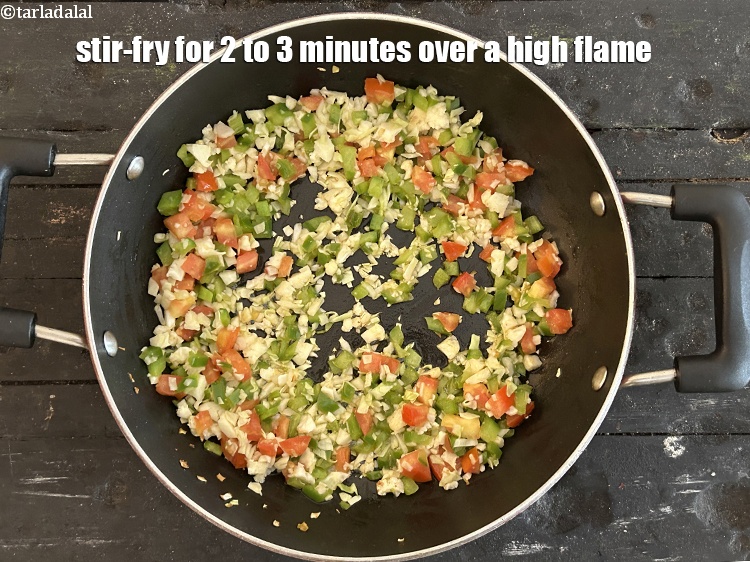 Step 14 – Stir-fry for 2 to 3 minutes over a high flame.