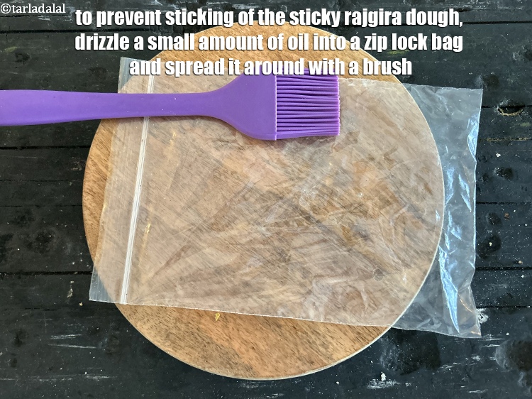Step 9 – To prevent sticking of the sticky rajgira dough, drizzle a small amount of oil into …