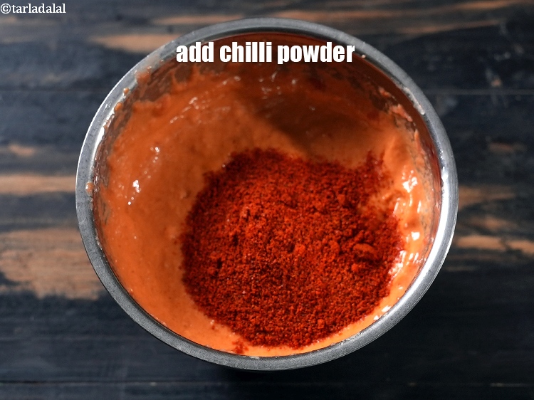 Step 8 – Add &frac12; tbsp <a href="https://www.tarladalal.com/glossary-chilli-powder-red-chilli-powder-339i">chilli powder</a>.