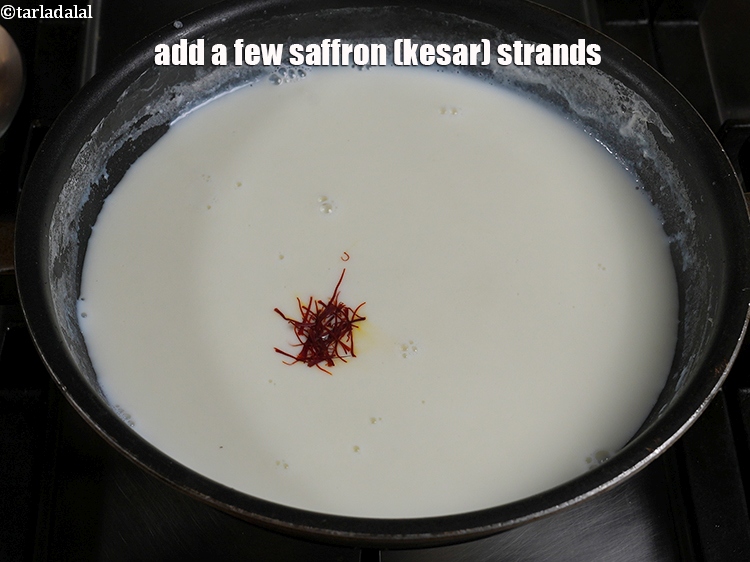 Step 10 – Add a few <a href="https://www.tarladalal.com/glossary-saffron-kesar-520i">saffron (kesar) strands</a>.