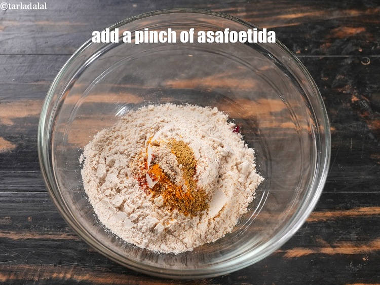 Step 9 – Add a pinch of <a href="https://www.tarladalal.com/glossary-asafoetida-hing-113i">asafoetida (hing)</a>.