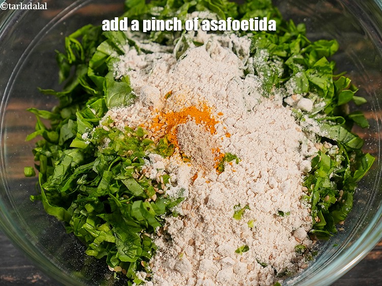 Step 9 – Add a pinch of <a href="https://www.tarladalal.com/glossary-asafoetida-hing-113i">asafoetida (hing)</a>.