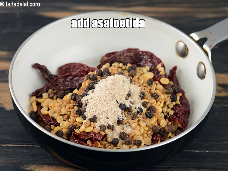 Step 10 – Add &frac12; tsp <a href="https://www.tarladalal.com/glossary-asafoetida-hing-113i">asafoetida (hing)</a>.