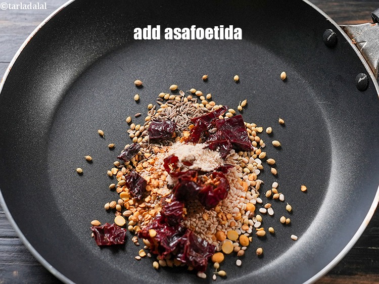 Step 9 – Add 1/2 tsp asafoetida (hing).
