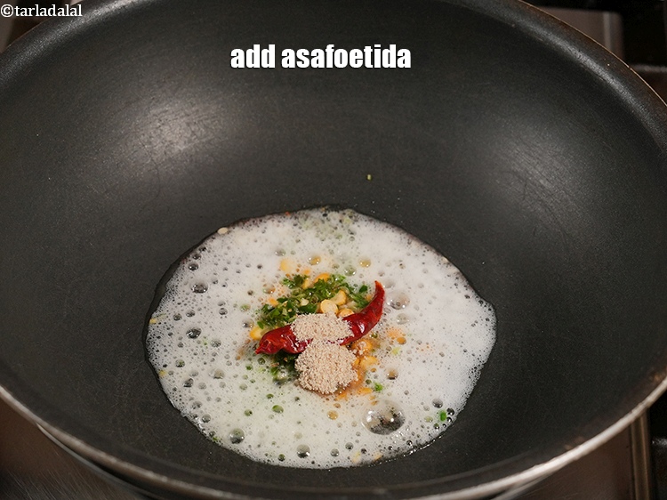 Step 9 – Add &frac14; tsp <a href="https://www.tarladalal.com/glossary-asafoetida-hing-113i">asafoetida (hing)</a>.&nbsp;