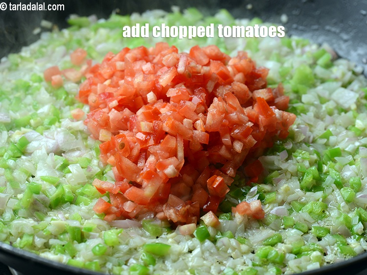 Step 10 – Add &frac12; cup <a href="https://www.tarladalal.com/glossary-chopped-tomatoes-779i">chopped tomatoes</a>.