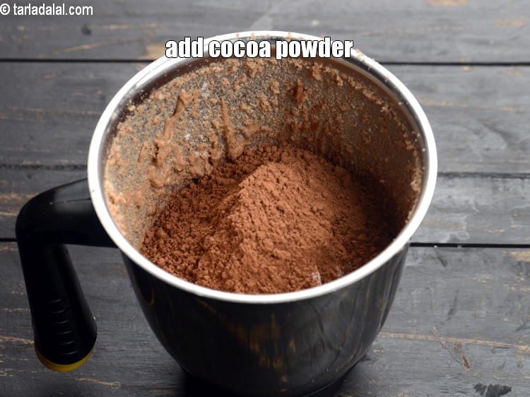 Step 9 – Add &frac12; cup <a href="https://www.tarladalal.com/glossary-cocoa-powder-284i">cocoa powder</a>.