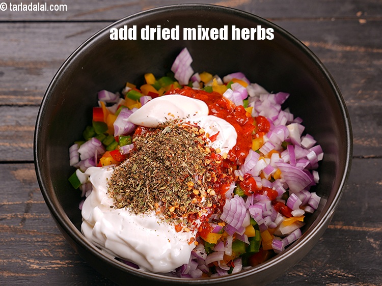Step 10 – Add 1 tsp <a href="https://www.tarladalal.com/glossary-dried-mixed-herbs-466i">dried mixed herbs</a>.
