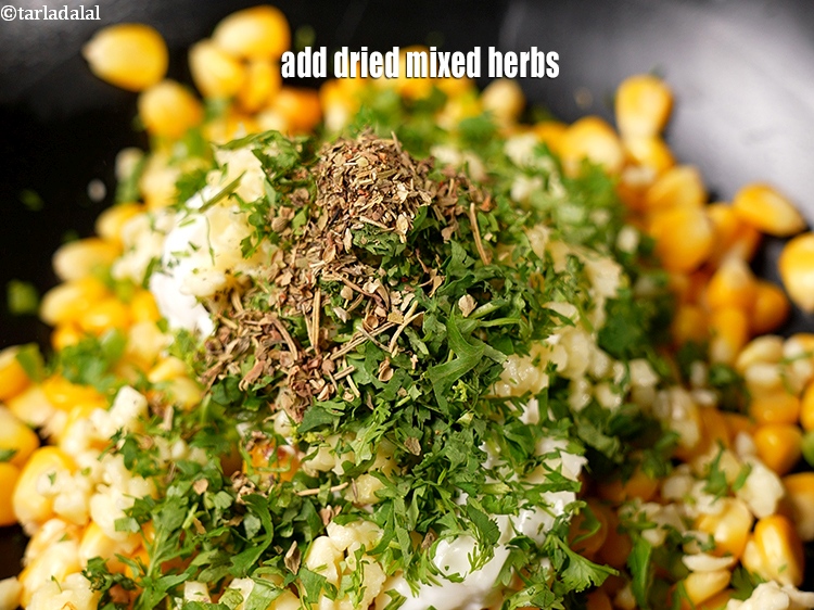 Step 9 – Add &frac12; tsp&nbsp;<a href="https://www.tarladalal.com/glossary-dried-mixed-herbs-466i">dried mixed herbs</a>.