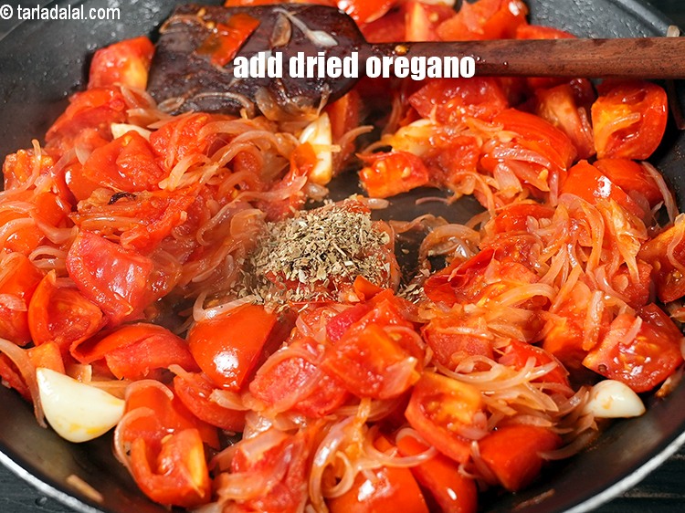 Step 9 – Add 1 tsp <a href="https://www.tarladalal.com/glossary-dried-oregano-268i">dried oregano</a>.