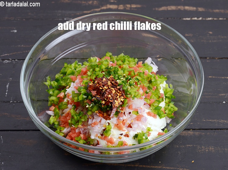 Step 9 – Add 1 tsp <a href="https://www.tarladalal.com/glossary-dry-red-chilli-flakes-paprika-338i">dry red chilli flakes (paprika)</a>.