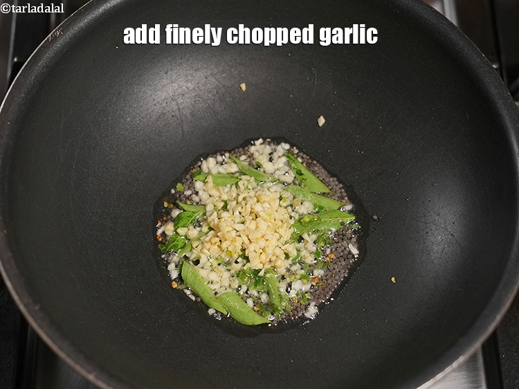 Step 12 – Add 1 tbsp finely&nbsp;<a href="https://www.tarladalal.com/glossary-chopped-garlic-790i">chopped garlic (lehsun)</a>.