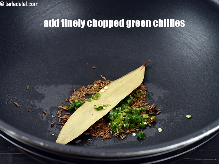 Step 9 – Add &frac12; tsp finely <a href="https://www.tarladalal.com/glossary-chopped-green-chilli-820i">chopped green chillies</a>.