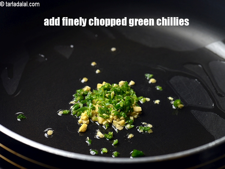 Step 9 – Add 1 tsp finely&nbsp;<a href="https://tarladalal.com/glossary-chopped-green-chilli-820i">chopped green chillies</a>.&nbsp;
