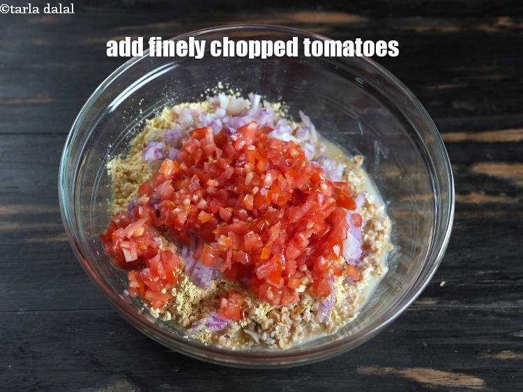 Step 9 – Add &frac12; cup finely <a href="https://www.tarladalal.com/glossary-chopped-tomatoes-779i">chopped tomatoes</a>.