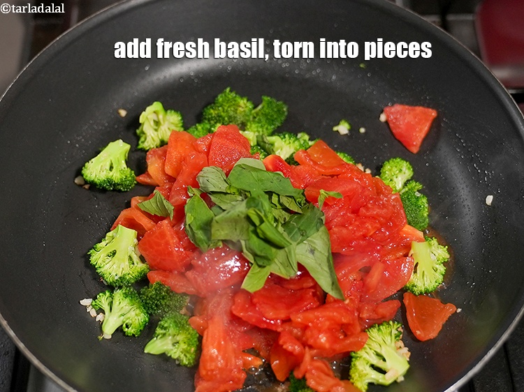 Step 9 – Add &frac14; cup fresh <a href="https://www.tarladalal.com/glossary-basil-185i">basil</a>, torn into pieces.