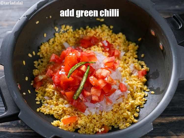 Step 9 – Add 1 slit green chilli.