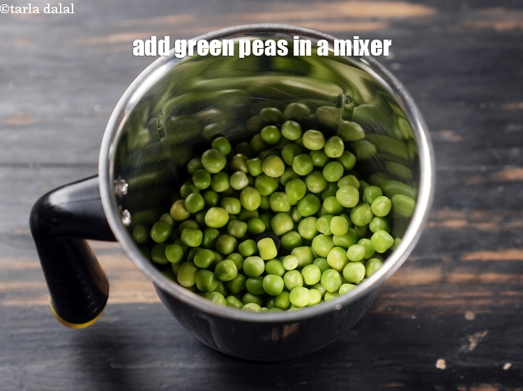 Step 9 – To make <strong>matar ka nimona</strong> recipe, add 1 cup green peas in a mixer.