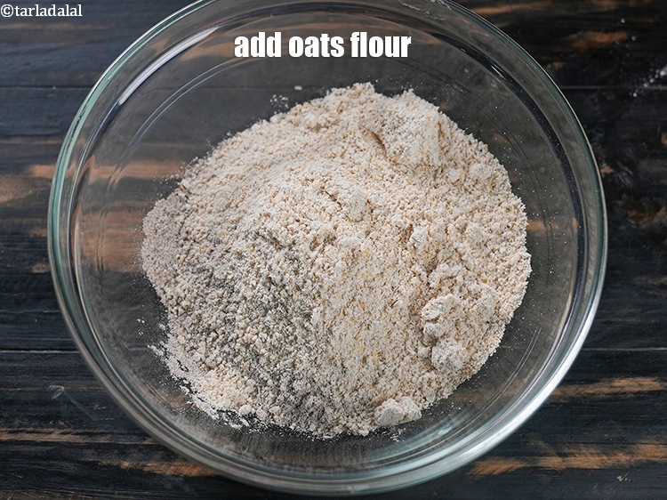 Step 9 – Add &frac12; cup <a href="https://www.tarladalal.com/glossary-oats-flour-oats-atta-2201i">oats flour</a>.