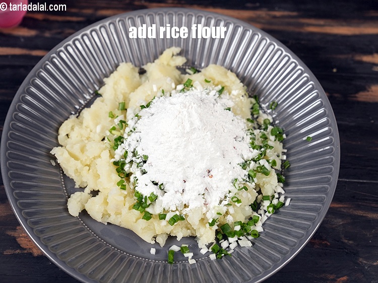 Step 9 – Add &frac14; cup <a href="https://www.tarladalal.com/glossary-rice-flour-chawal-ka-atta-534i">rice flour (chawal ka atta)</a>.