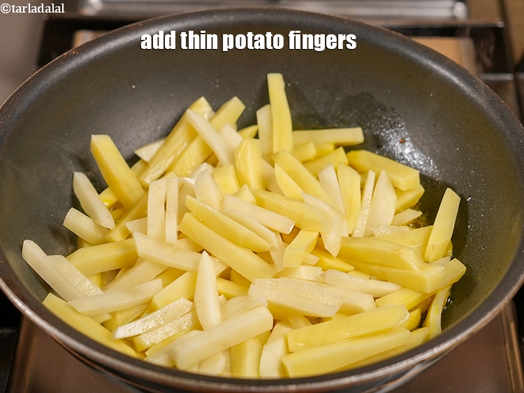 Step 9 – Add 4 cups thin <a href="https://www.tarladalal.com/glossary-potato-fingers-1065i">potato fingers</a>.&nbsp;