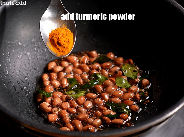 Step 9 – Add &frac12; tsp <a href="https://www.tarladalal.com/glossary-turmeric-powder-haldi-645i">turmeric powder (haldi)</a>.&nbsp;